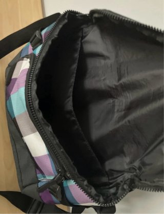 Bolso Rip Curl cuadros morado y turquesa