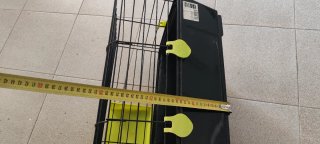 Jaula para mascotas negra y amarilla