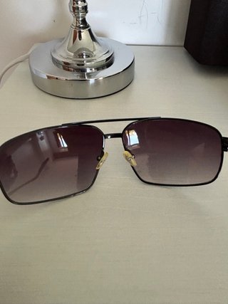 Gafas de sol Armani Exchange negras.