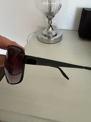 Gafas de sol Armani Exchange negras.