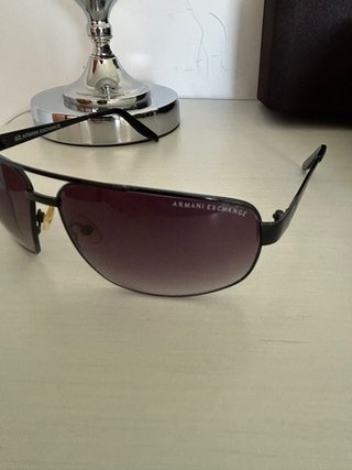 Gafas de sol Armani Exchange negras.