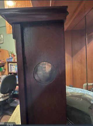 Reloj de péndulo antiguo de madera