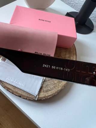 Occhiali da sole polarizzati Miu Miu marroni