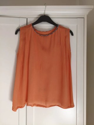 Camiseta naranja sin mangas