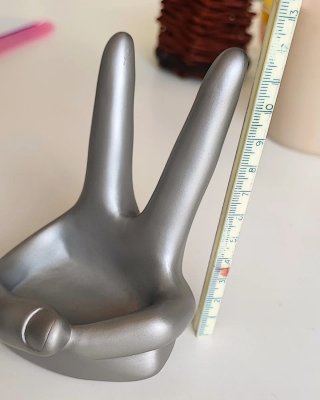Soporte teléfono mano plástico plateado