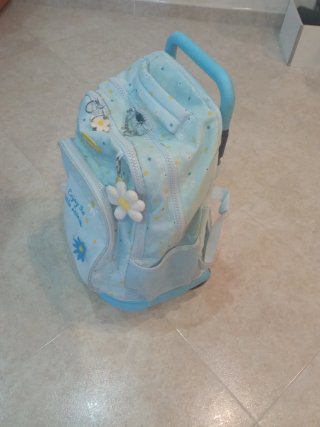 Mochila escolar con ruedas y diseño de margaritas