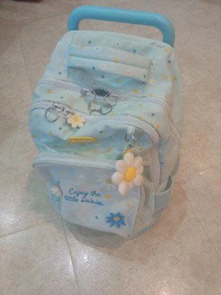 Mochila escolar con ruedas y diseño de margaritas