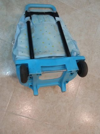Mochila escolar con ruedas y diseño de margaritas