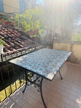 Tavolo esterno in ceramica e ferro