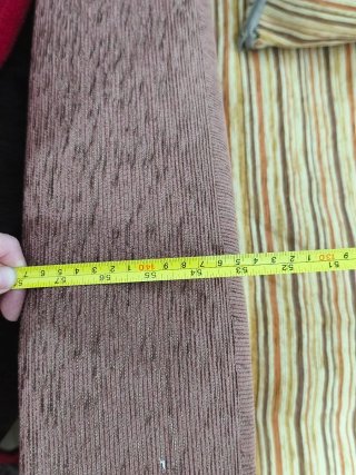 Sofá cama de tela beige y marrón