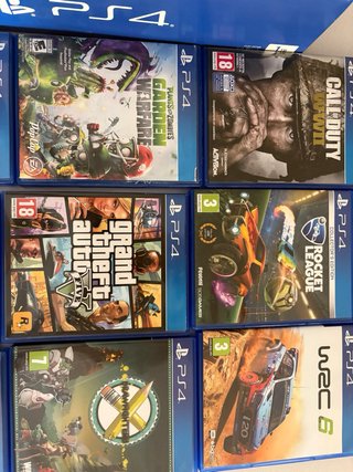 PS4 Slim 1TB + Mando Nacon + 20 Juegos