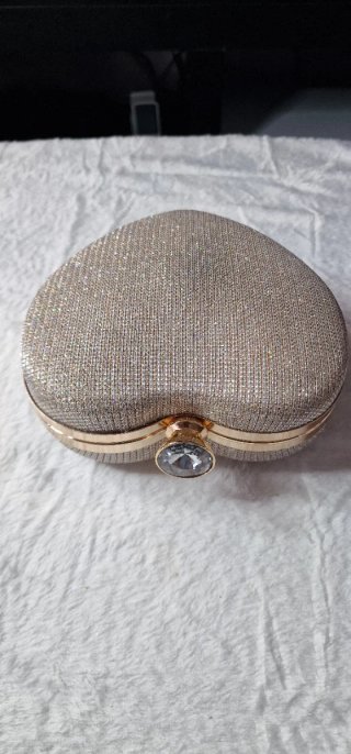 Bolso d mano con pedrería y cierre joyaLEER DESCRP