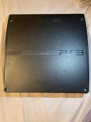 Playstation 3 con 2 mandos y 7  juegos