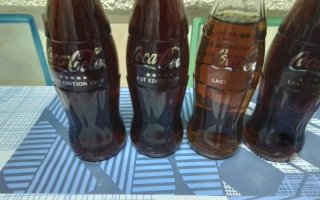 12 bottiglie Coca-Cola ultima edizione 1999 Svizzera