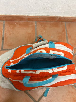 Paletero de pádel naranja y blanco