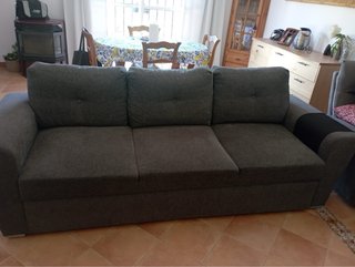 Sofá cama gris de tela
