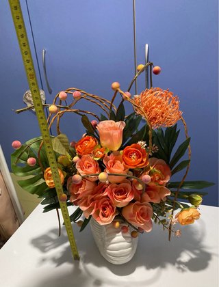 Composizione fiori artificiali arancio
