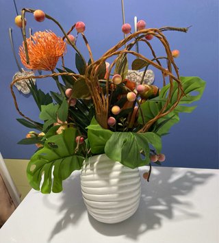 Composizione fiori artificiali arancio
