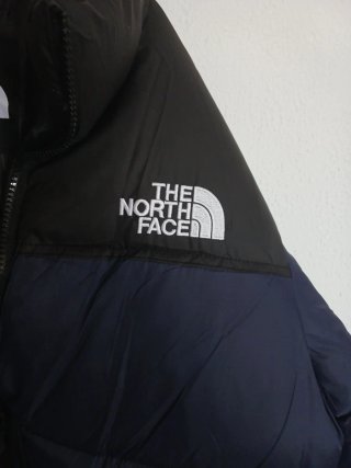 The North Face plumífero azul y negro Talla L