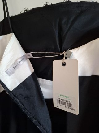 Vestido fiesta negro y blanco con lazo frontal