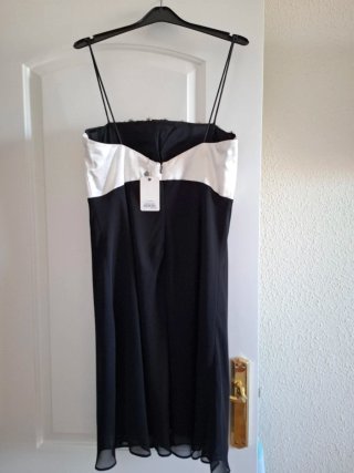 Vestido fiesta negro y blanco con lazo frontal