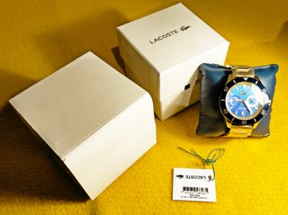 Reloj Lacoste nuevo, dorado y azul