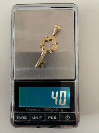 COLGANTE ORO 18 QUILATES, LLAVE