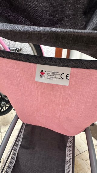 Carrito para muñecas rosa