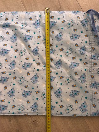 Protector de cuna con estampado infantil