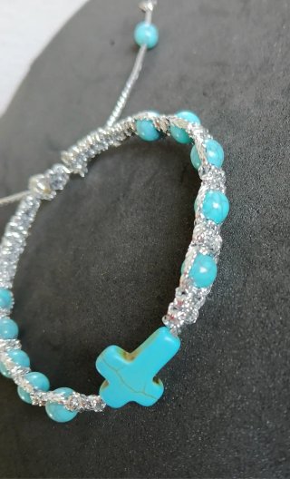 Pulsera decenario con cruz y cuentas turquesa