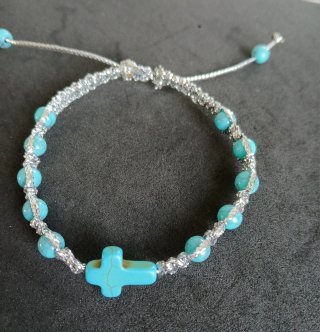 Pulsera decenario con cruz y cuentas turquesa