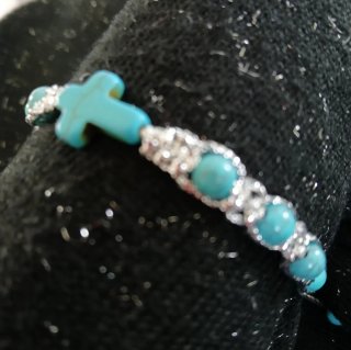Pulsera decenario con cruz y cuentas turquesa