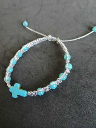 Pulsera decenario con cruz y cuentas turquesa