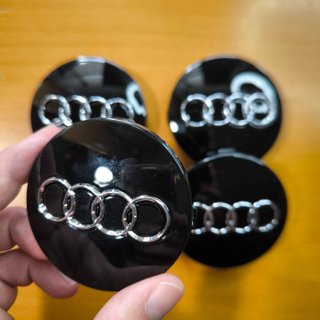 TAPABUJES AUDI 60mm NEGRO - EMBLEMA LLANTAS AUDI
