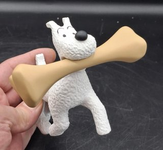 Divertida figura de Milú con un gran Hueso