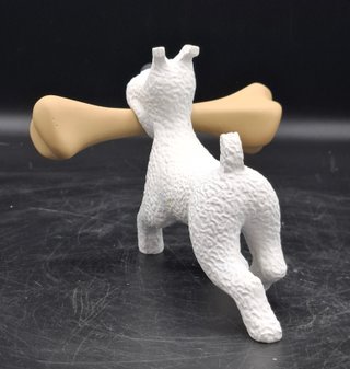 Divertida figura de Milú con un gran Hueso