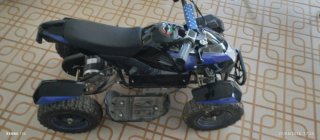 Quad infantil negro y azul de bateria