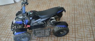 Quad infantil negro y azul de bateria