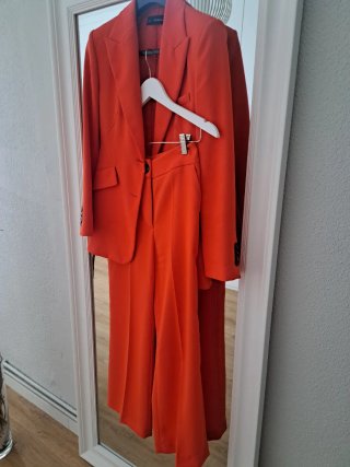 Traje de chaqueta esfera naranja