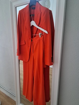 Traje de chaqueta esfera naranja