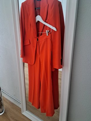 Traje de chaqueta esfera naranja