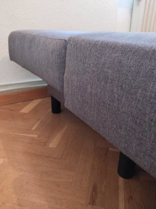 Sofá cama (1.30) con 3 plazas color gris.