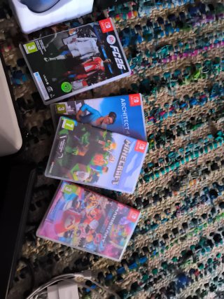 Lote Nintendo Switch Azul/Rojo con juegos y mando