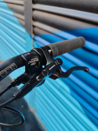 Bici B'TWIN MTB RockShox + Deore + Maxxis