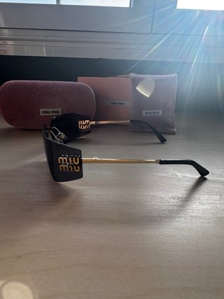 Gafas Miu Miu Cristal Oscuro Dorado