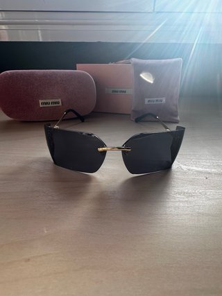 Gafas Miu Miu Cristal Oscuro Dorado