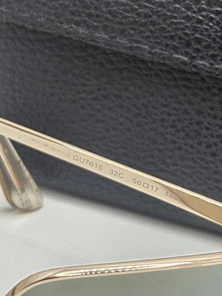Gafas de sol Guess doradas y plateadas