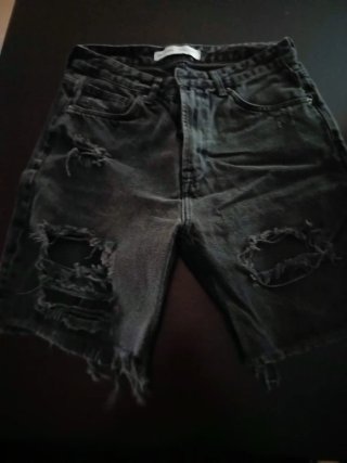 Pantalones vaqueros rotos grises