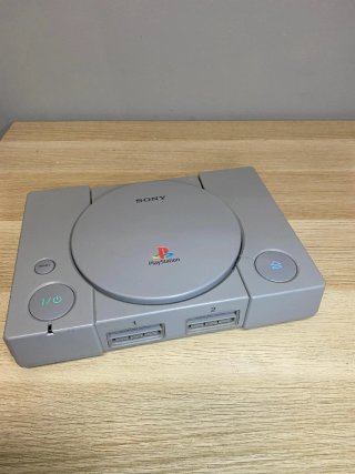 Sony PlayStation PS1 Gris con Mando transparente