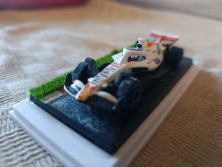 Hotwheels Fórmula 1 con peana y vitrina